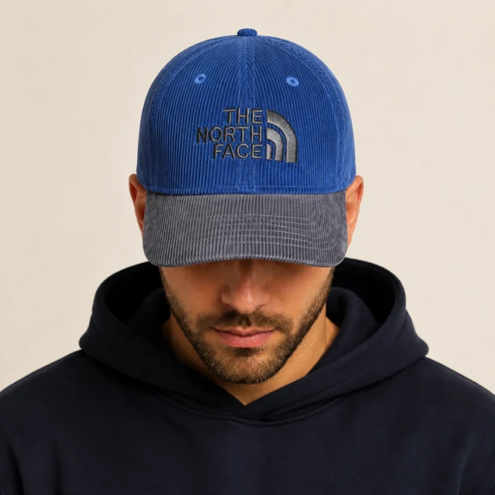 north-face-blue-charcoal-cap-model-main Premium Two-Tone Corduroy Cap – Navy & Charcoal - Image 1